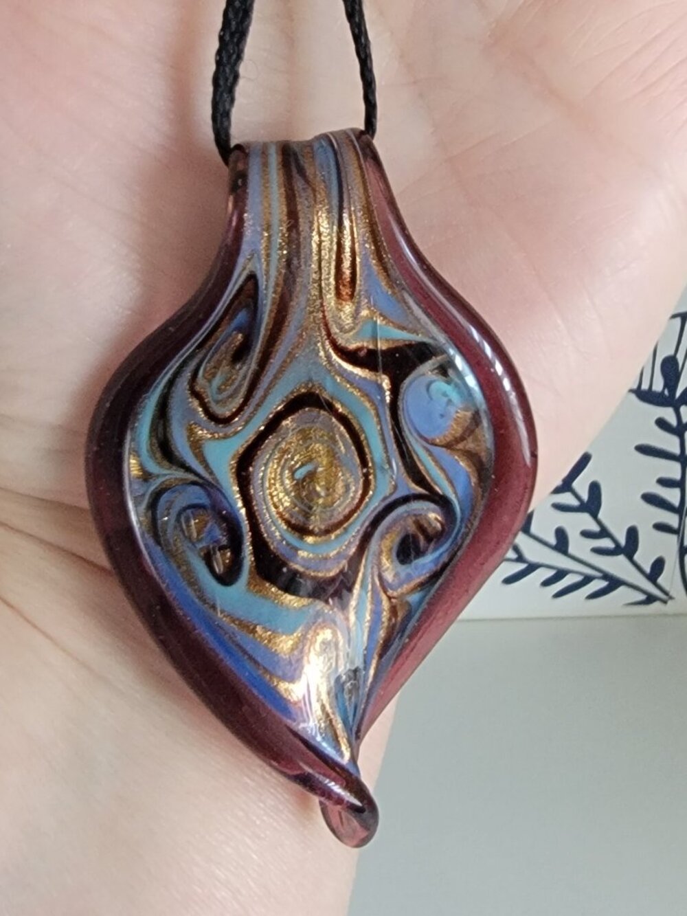 Glass pendant necklace; purple blue gold swirl